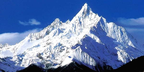Meili Snow Mountain in Yunnan, China, featuring towering snow-capped peaks, pristine alpine landscapes, and dramatic mountain scenery in one of China's most spectacular eco-tourism destinations.
