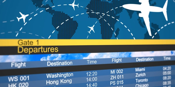Airport departure board and global flight routes map, representing secure flight ticket booking through a trusted travel agency.